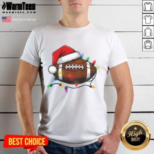 Christmas football player wearing a Santa hat on a T-shirt, celebrating the holiday spirit with festive sportswear.