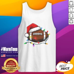 Christmas football player in tank top wearing a Santa hat, ready for festive holiday fun and games this season.
