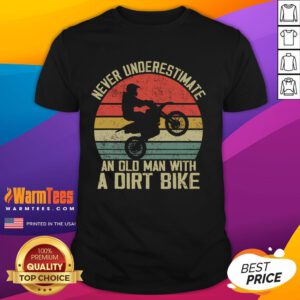 Alt Text: Vintage sunset T-shirt featuring the phrase Never Underestimate An Old Man With A Dirt Bike. Perfect for bike enthusiasts.