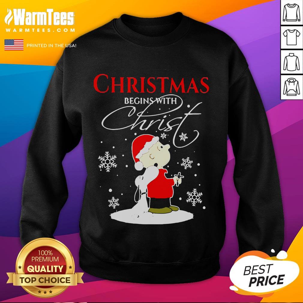 Cute Christmas Begins With Christ sweatshirt featuring Snoopy in a festive holiday costume for cozy winter style.