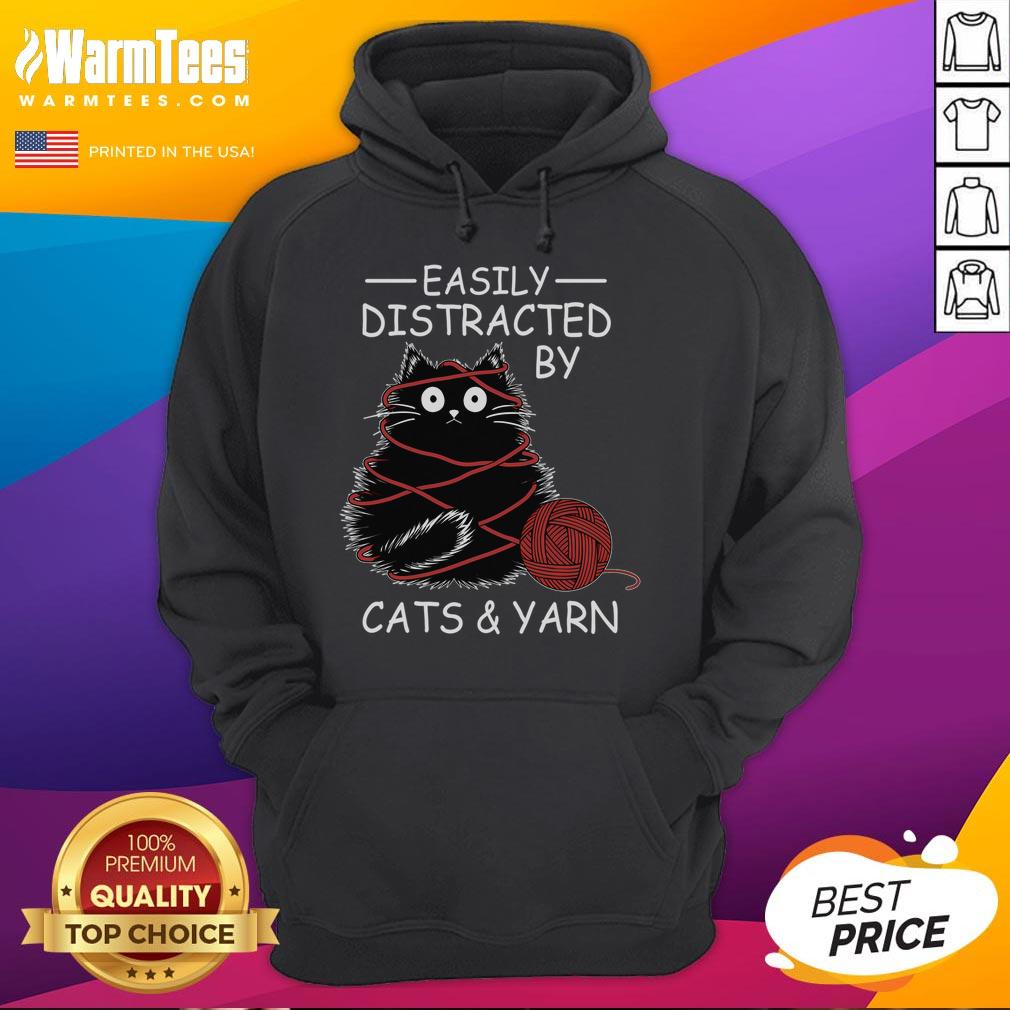 Cute kitten lover wearing a crochet hoodie, easily distracted by cats and yarn, showcasing playful feline fun.