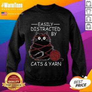 Cozy crochet sweatshirt for kitten lovers, featuring a cute design of easily distracted cats and colorful yarn.