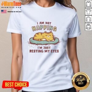 Alt Text: Cute cat lounging with eyes closed on 'I Am Not Napping, I'm Just Resting My Eyes' tee for cat lovers.