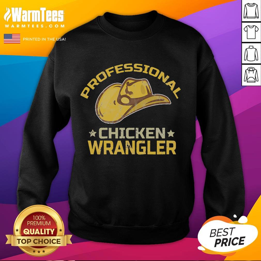Funny chicken farmer wearing a sweatshirt, showcasing humor in professional chicken wrangling on the farm.
