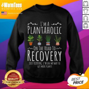 Funny gardener wearing 'I'm a Plantaholic on the Road to Recovery' sweatshirt, showcasing love for gardening humor.