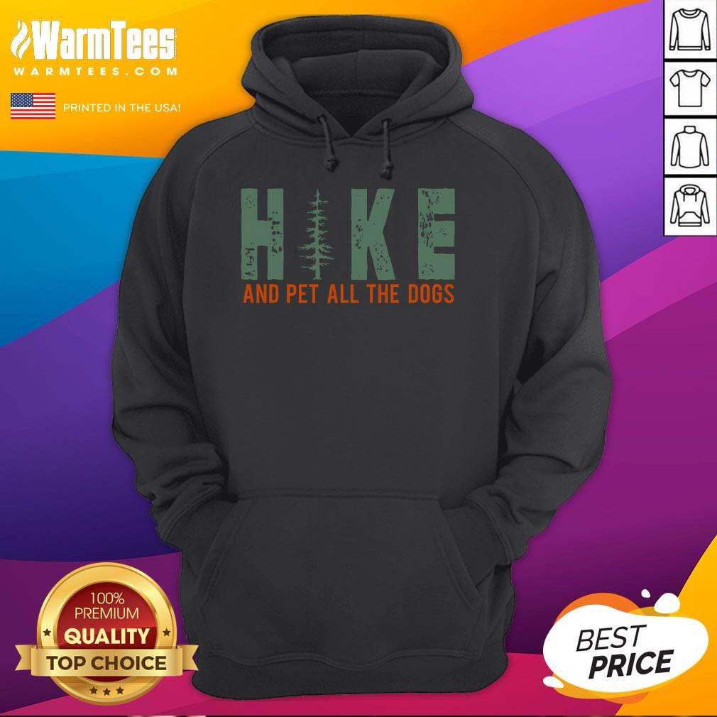 Funny hike and pet all the dogs hiking dog lover hoodie worn by a cheerful hiker in a scenic outdoor setting.