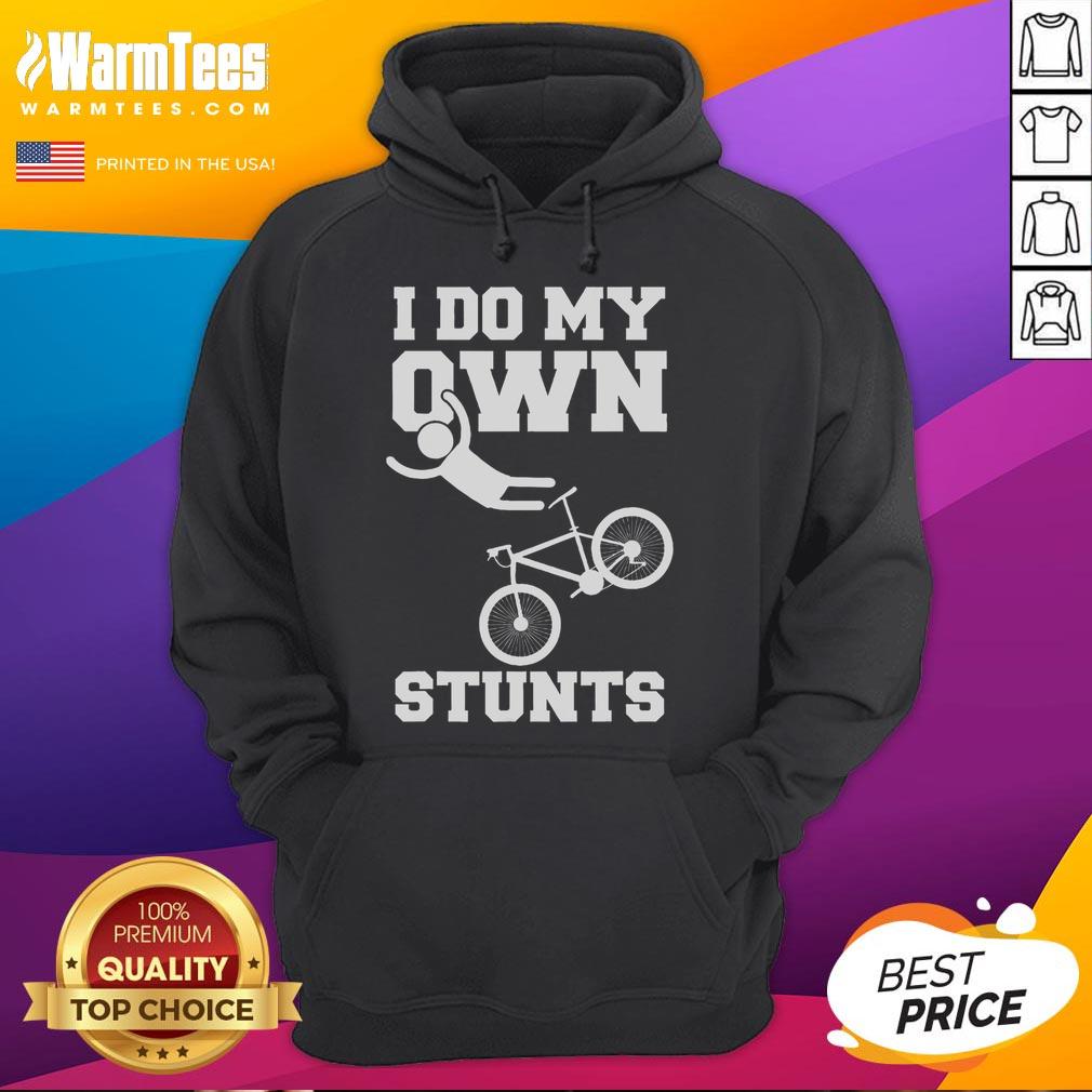 Funny 'I Do My Own Stunts' hoodie wearer with a broken arm in a hospital, showcasing recovery and humor in biking accidents.