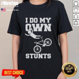 Funny 'I Do My Own Stunts' tee with a woman in a hospital bed, broken arm in cast, showcasing humor in recovery.