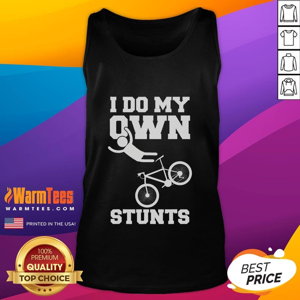 Funny 'I Do My Own Stunts' tank top worn by person with broken arm in hospital recovery with cast, showcasing humor in injury.