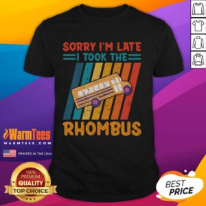 Funny math teacher wearing a vintage Sorry I'm Late I Took The Rhombus T-shirt in a classroom setting.