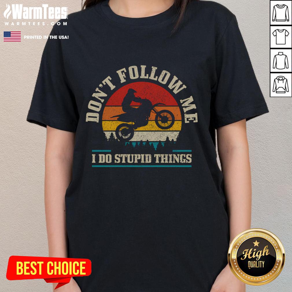 Vintage motocross tee for ladies featuring 'Don't Follow Me, I Do Stupid Things' design against a sunset backdrop.