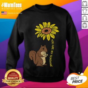 Cute squirrel with a sunflower on a cozy sweatshirt reading You Are My Sunshine for a delightful fashion statement.
