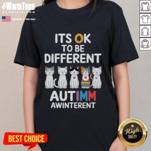 Alt Text: Cute autism awareness cat graphic on a ladies tee, promoting the message 'It's OK to be different'.