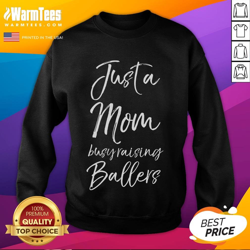Adorable sweatshirt for moms titled 'Just a Mom Busy Raising Ballers' featuring a cute basketball design.