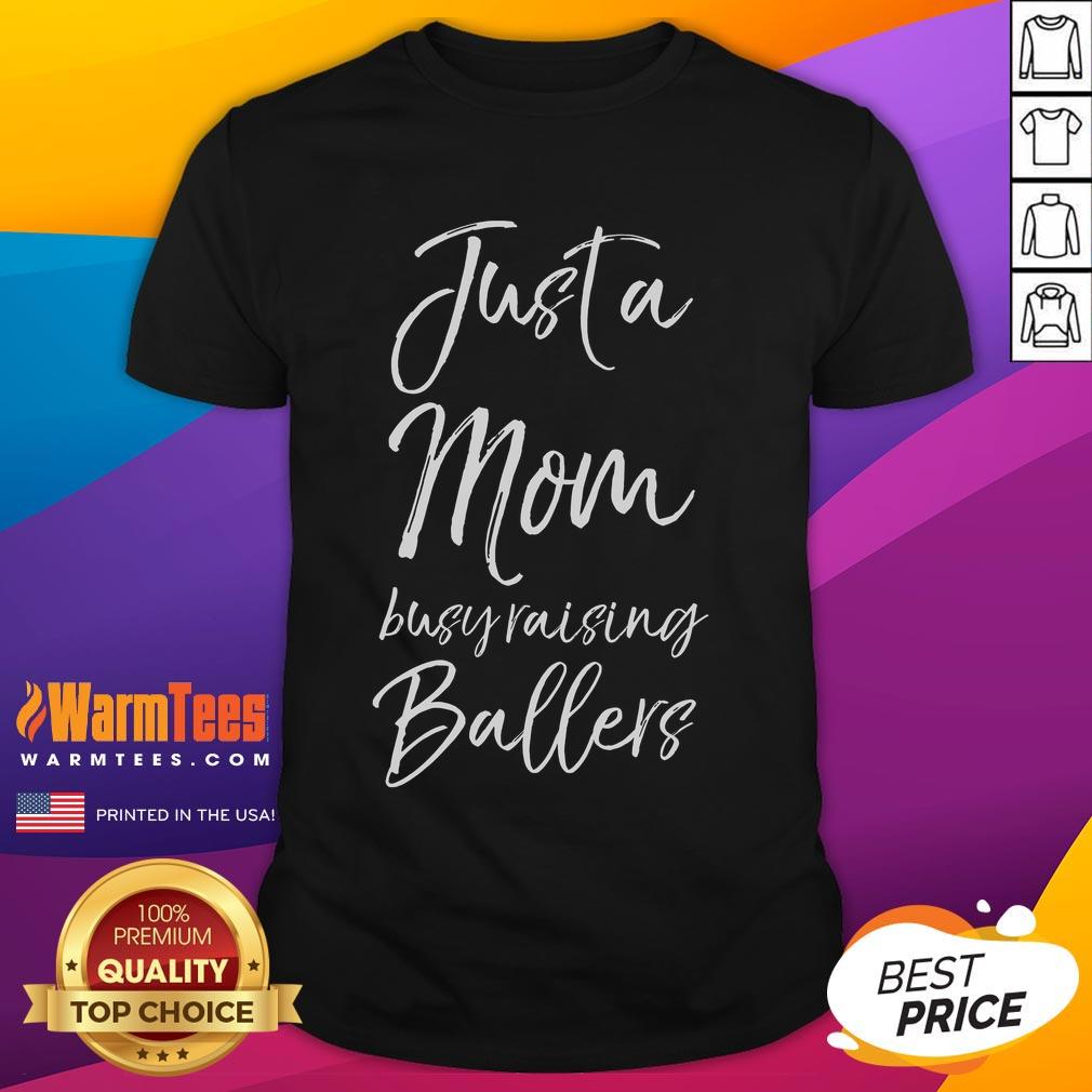 Alt Text: Cute Basketball Mother T-Shirt design featuring 'Just A Mom Busy Raising Ballers' slogan for proud basketball moms.