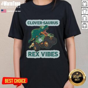 Funny St. Patrick's Day tee featuring a shamrock dinosaur, perfect for Irish American tradition and festive celebrations.