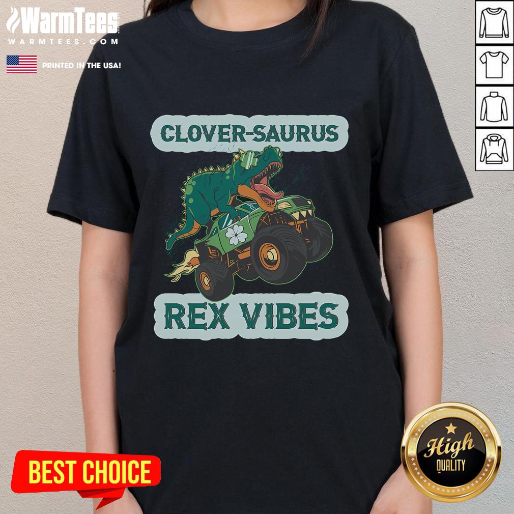 Funny St. Patrick's Day tee featuring a shamrock dinosaur, perfect for Irish American tradition and festive celebrations.