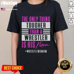 Funny ladies tee featuring 'The Only Thing Tougher Than A Wrestler Is His Mom' design, perfect for wrestling fans.