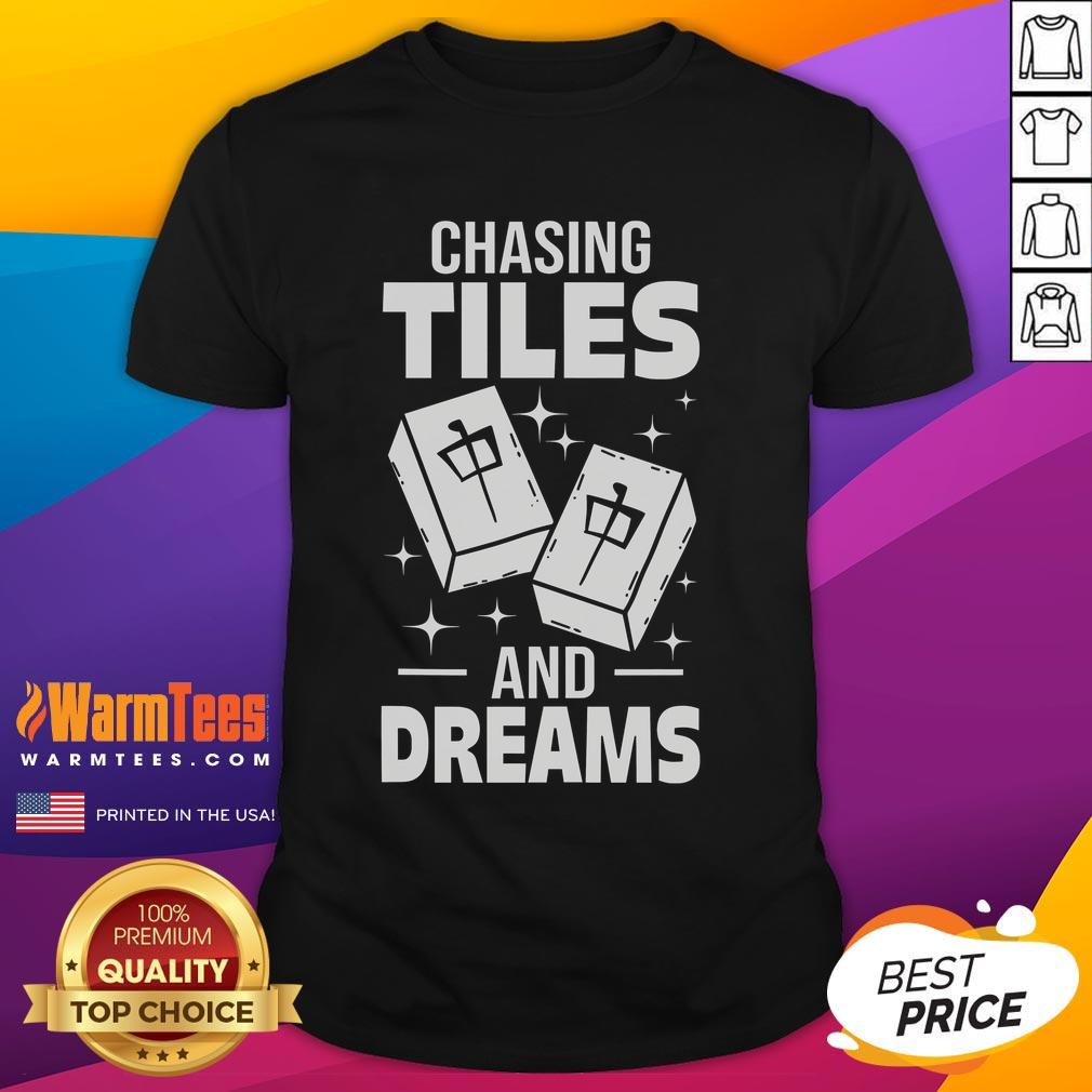 Asian player wearing 'Good Mahjong Chasing Tiles And Dreams' T-shirt, showcasing a passion for Mahjong and cultural pride.