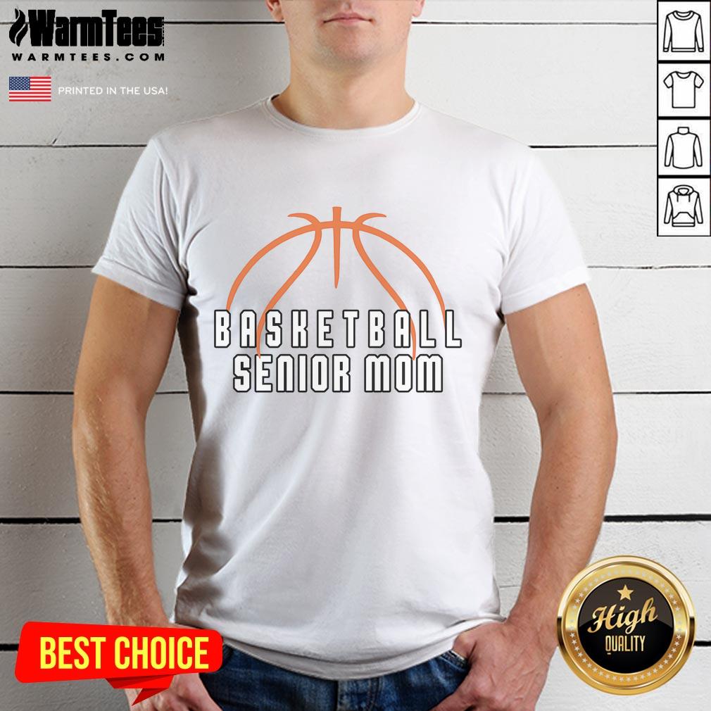 Alt Text: Happy mom wearing a Senior Basketball Mom T-shirt, proudly celebrating her graduating player's achievements.