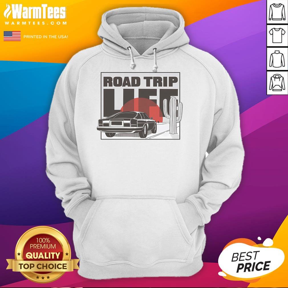 Vintage car on a scenic road trip at sunset, featuring a cozy hoodie, capturing the essence of adventure and nostalgia.