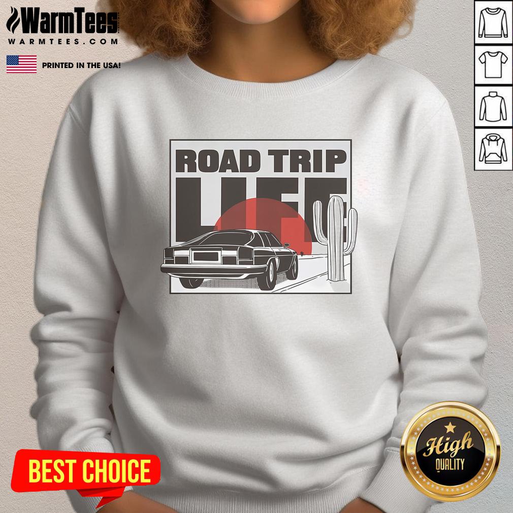 Vintage car on a scenic road trip at sunset, featuring a cozy sweatshirt with 'Nice Road Trip Life' design.