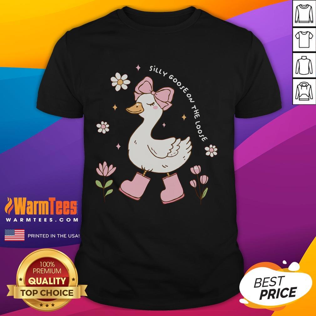 Alt Text: Cute silly goose wearing a coquette bow on a t-shirt, perfect for goose lovers and fun fashion enthusiasts.
