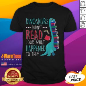 Alt Text: Cute teacher wearing a Dinosaurs Didn't Read T-shirt, promoting book reading with playful dinosaur graphics.