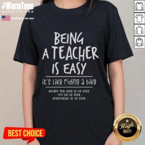 Funny 'Being a Teacher is Easy Like Riding a Bike' ladies tee design showcasing humor in education apparel.