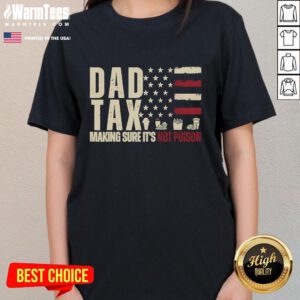 Funny dad in a USA flag tee, playfully checking tax forms with a humorous twist. Perfect for tax season laughs!