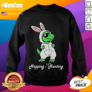 Alt Text: Funny dino in cute Easter bunny rabbit costume on sweatshirt, perfect for festive celebrations and dinosaur lovers.