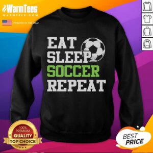 Alt Text: Funny Eat Sleep Soccer Repeat sweatshirt worn by a soccer player, perfect for fans and athletes who love soccer.