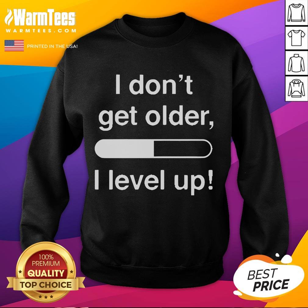 Alt Text: Funny 'I Don't Get Older, I Level Up' sweatshirt featuring a playful design, perfect for gamers and humor lovers.
