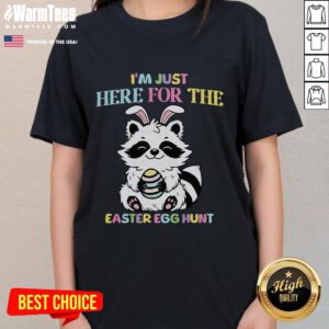 Raccoon graphic on a tee shirt with the phrase 'I'm just here for the Easter egg hunt' for women, perfect for Easter festivities.