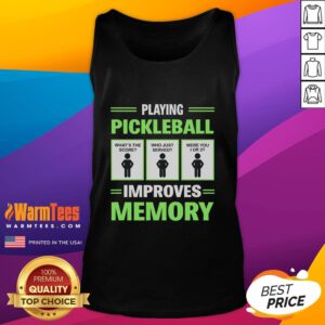 Person wearing a funny pickleball tank top, smiling while playing pickleball to boost memory and brain health.