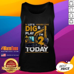 Happy birthday boy in an excavator-themed tank top celebrating his 2nd birthday with construction decorations.