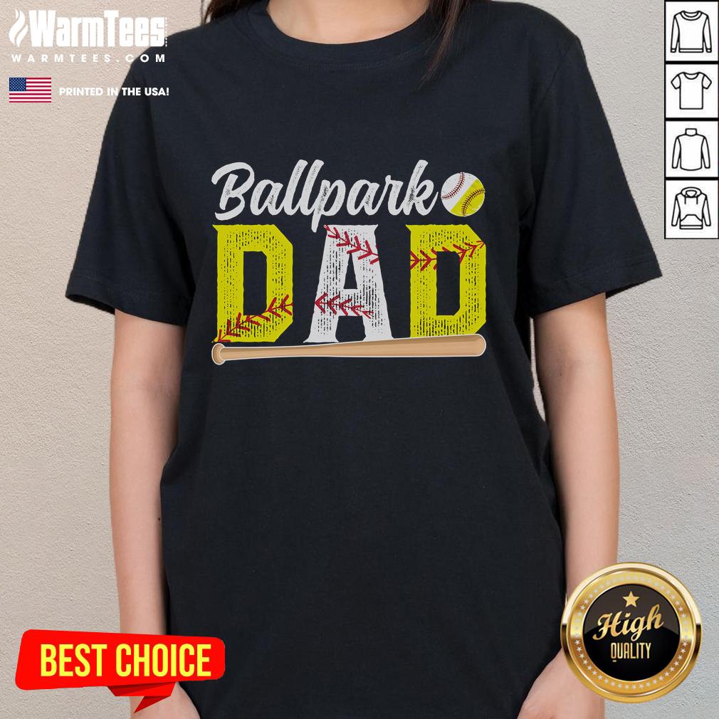Happy dad wearing a 'Baseball Softball Dad' tee at the ballpark, enjoying time with his kids during a game.