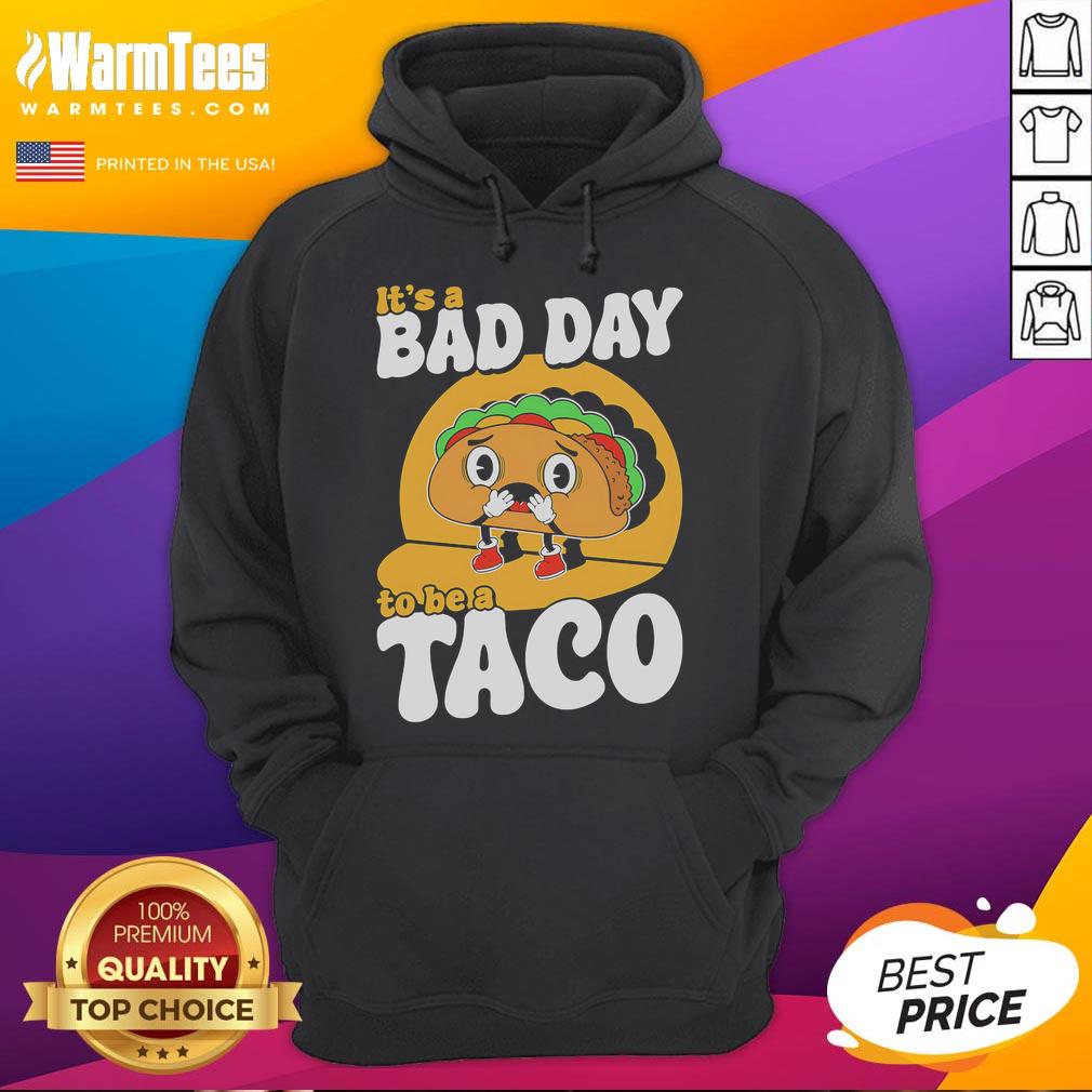 Alt Text: Cute 'It's A Bad Day To Be A Taco' hoodie featuring a fun taco graphic, perfect for casual wear and taco lovers.