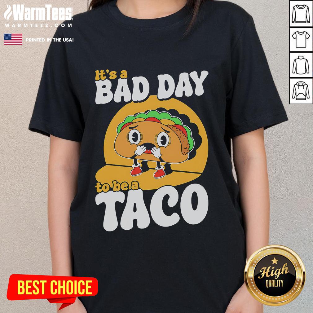 Alt Text: Cute 'It's A Bad Day To Be A Taco' ladies tee showcasing fun taco-themed graphic design for casual wear.
