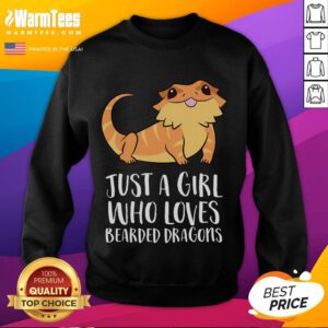 Alt Text: Cute girl wearing a sweatshirt that says Just a Girl Who Loves Bearded Dragons with a lizard in her hands.