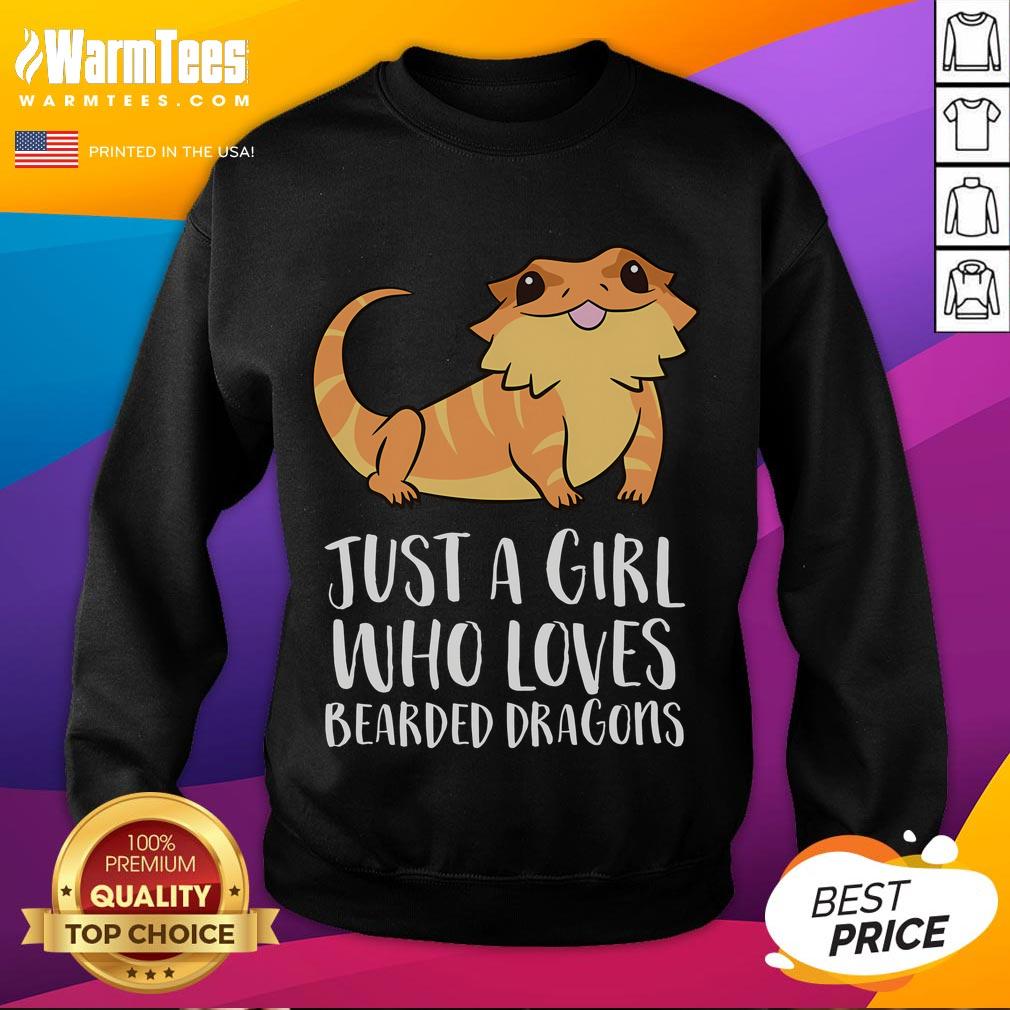 Alt Text: Cute girl wearing a sweatshirt that says Just a Girl Who Loves Bearded Dragons with a lizard in her hands.