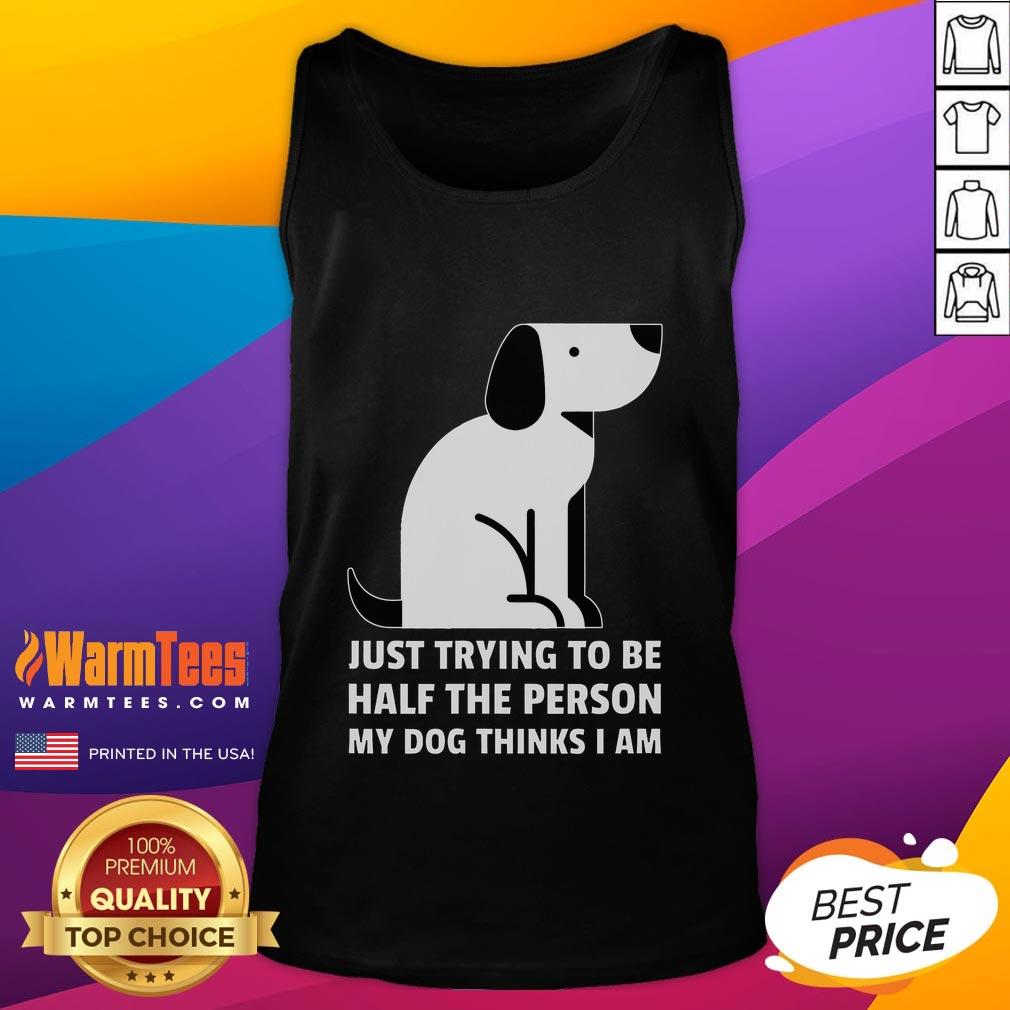 Person in tank top smiling with their dog, embodying the love and joy of being half the person their dog thinks they are.