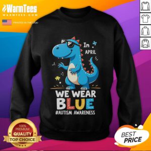 Cute T-Rex dinosaur with sunglasses on an autism awareness sweatshirt, promoting acceptance and fun.