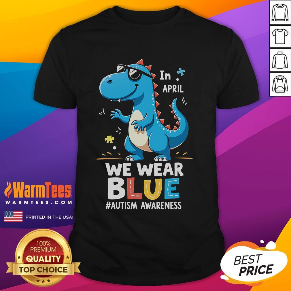 Alt Text: Cute T-Rex dinosaur wearing sunglasses on an Autism Awareness T-shirt, promoting positivity and inclusion.