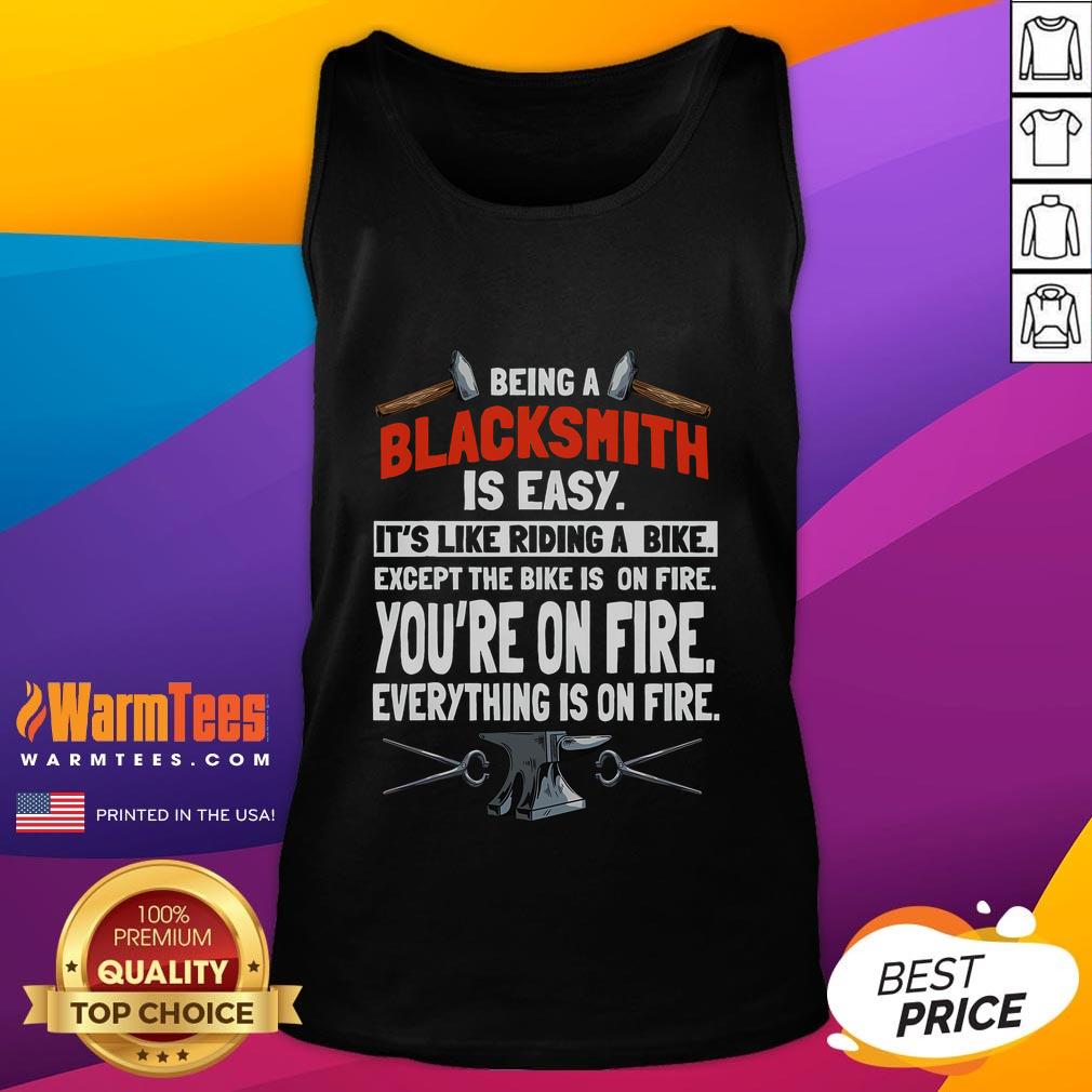 Funny blacksmith tank top featuring the quote: 'Being a blacksmith is easy, it's like riding a bike, except everything is on fire.'