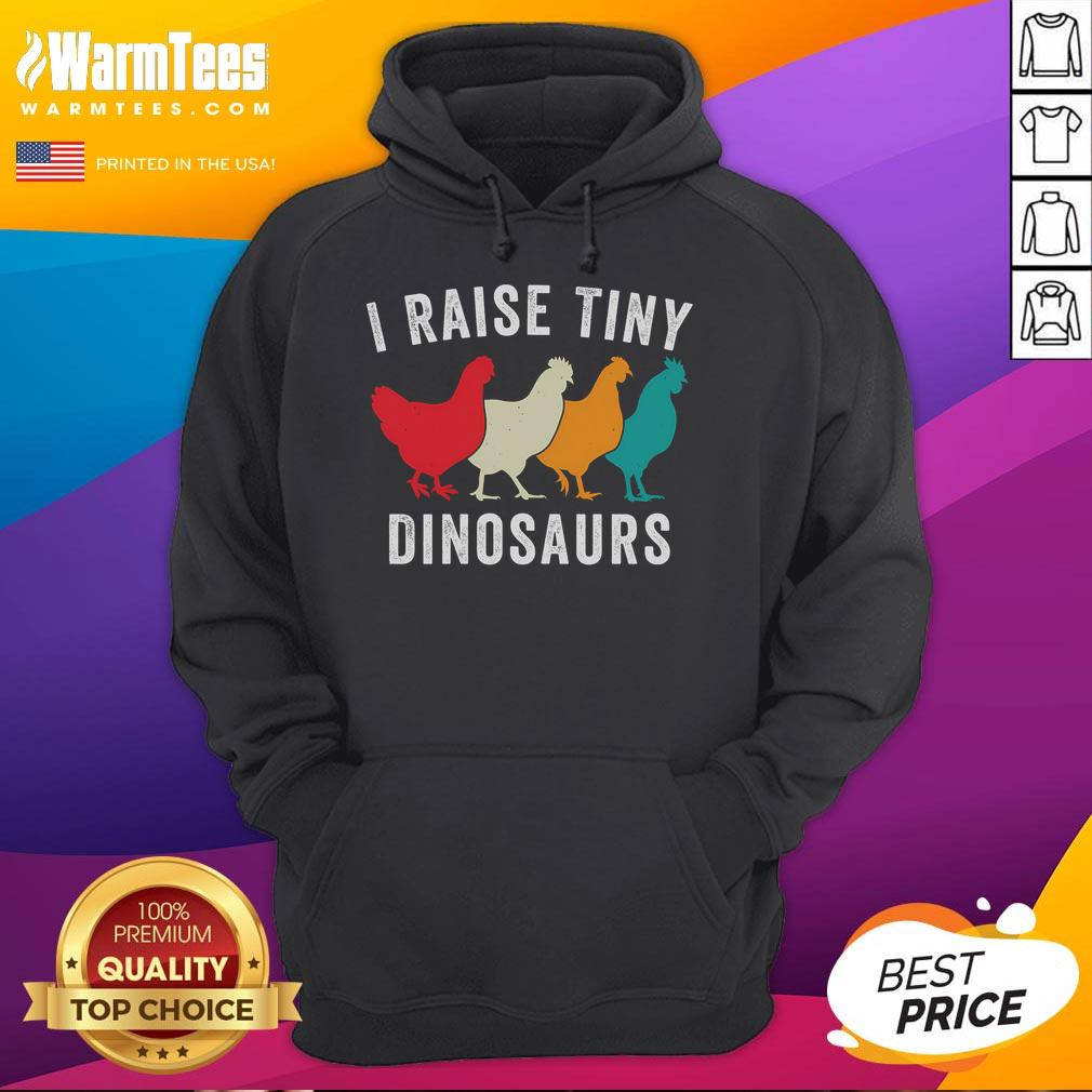 Funny chickens in a backyard, showcasing the 'I Raise Tiny Dinosaurs' hoodie for chicken lovers on a homestead.