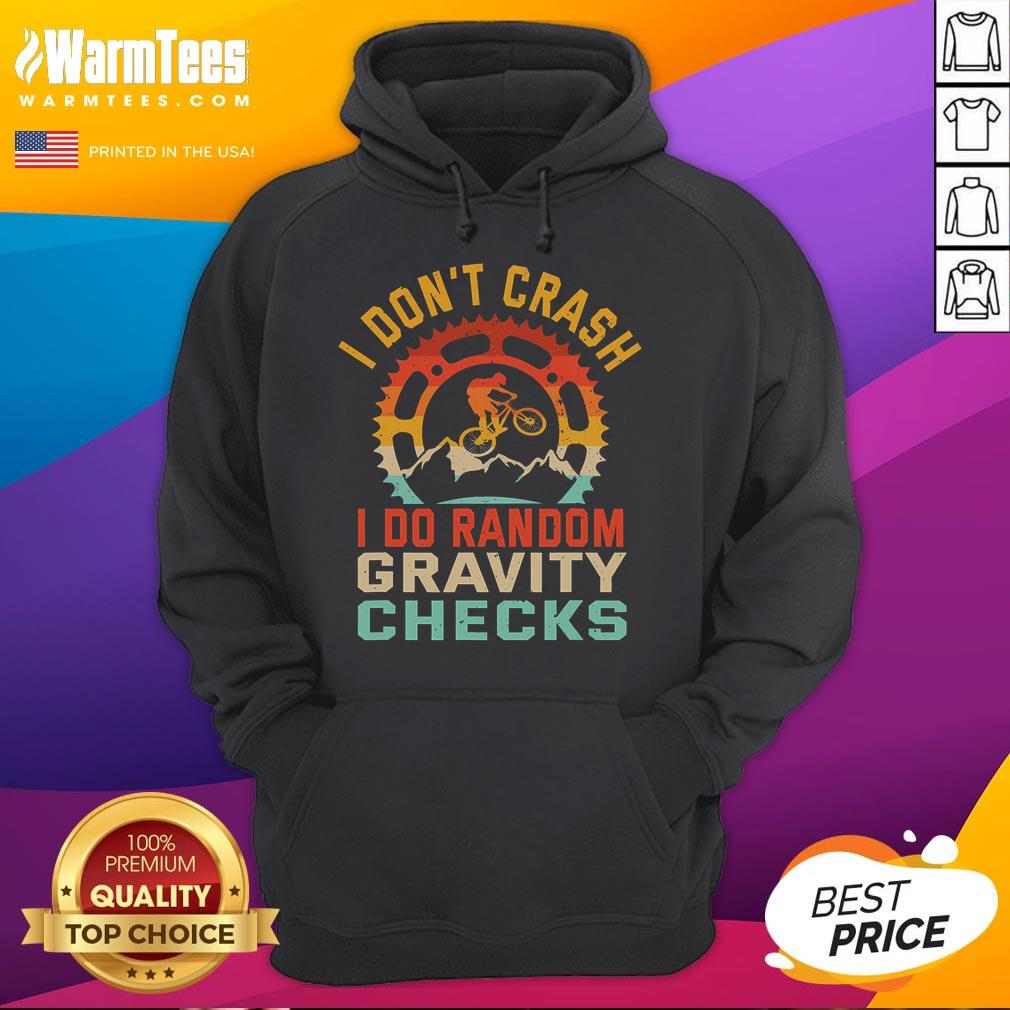 Funny 'I Don't Crash, I Do Random Gravity Checks' mountain biking hoodie design with playful graphics and vibrant colors.