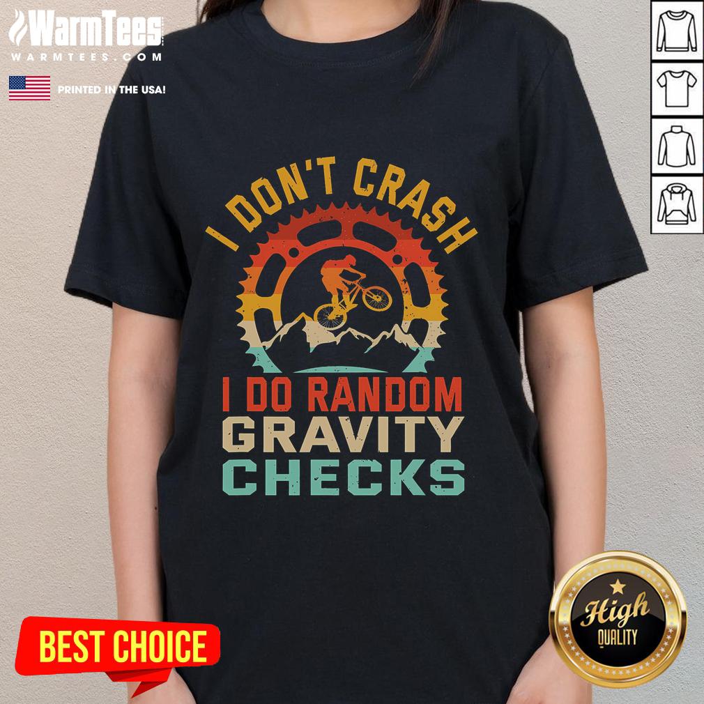 Funny 'I Don't Crash, I Do Random Gravity Checks' mountain biking ladies tee featuring a playful design and vibrant colors.