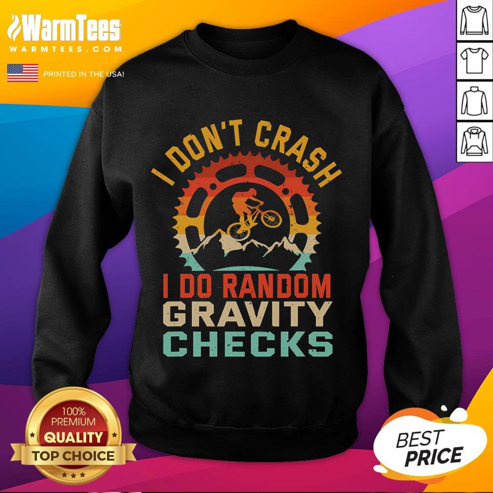 Funny sweatshirt with 'I Don't Crash, I Do Random Gravity Checks' design for mountain biking enthusiasts.
