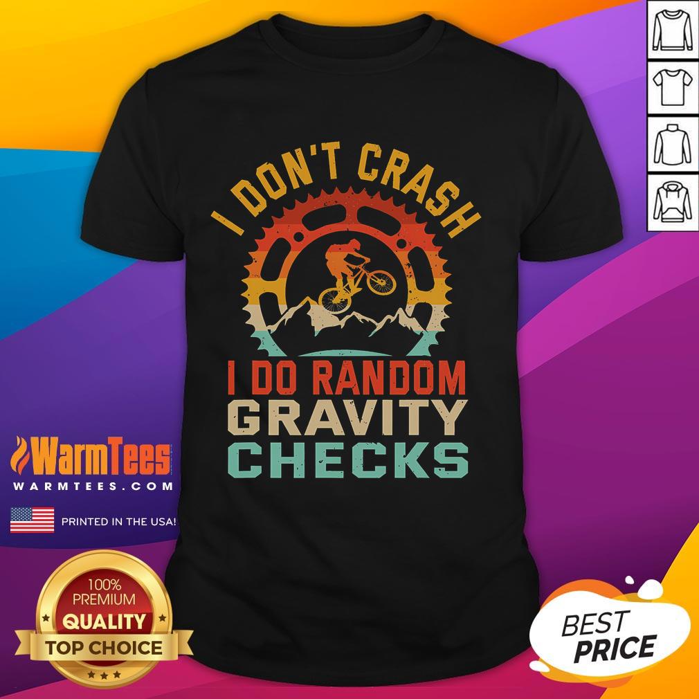 Alt Text: Funny I Don't Crash, I Do Random Gravity Checks mountain biking t-shirt design with humorous graphics for cyclists.